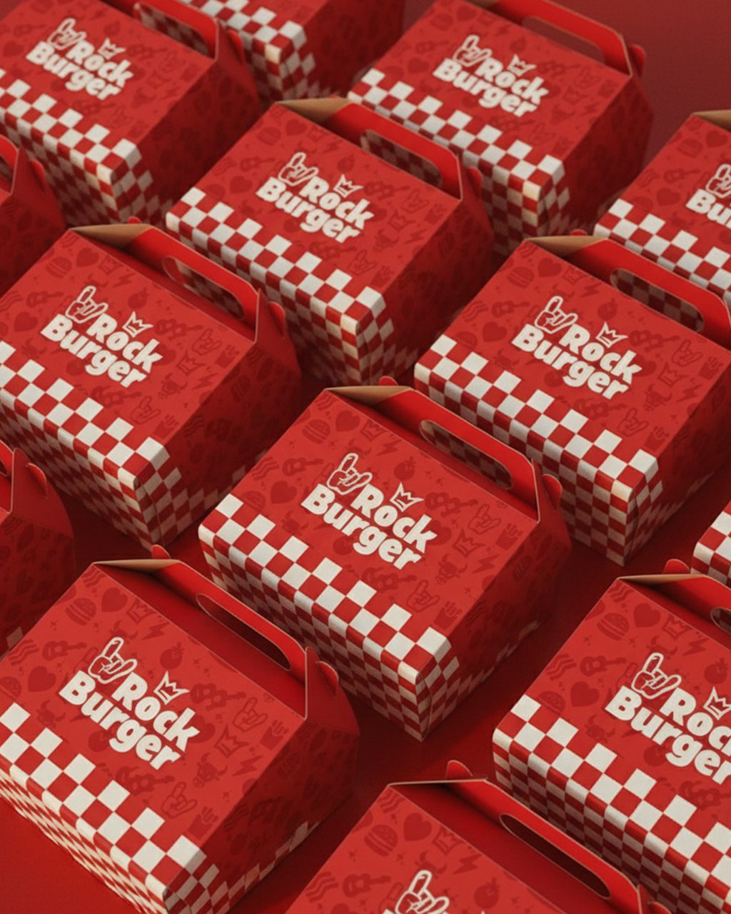 A imagem faz parte do projeto de Identidade Visual da Rock Burger e mostra as caixas de hamburger pensadas para a marca